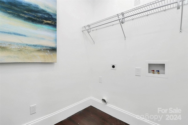 washroom with hookup for an electric dryer, hardwood / wood-style floors, and washer hookup