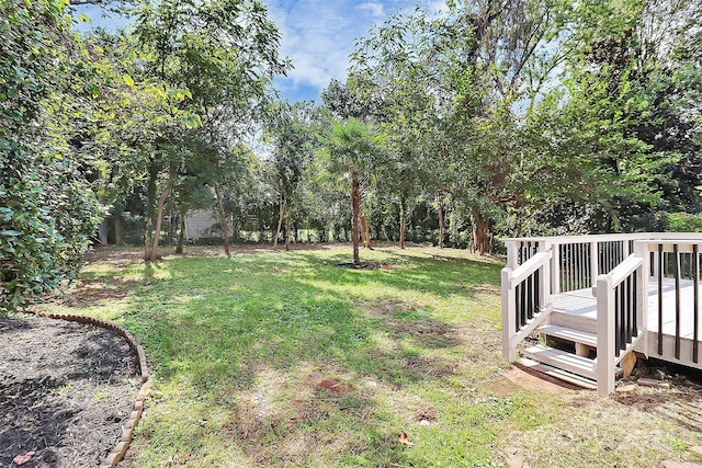 view of yard featuring a wooden deck