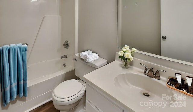 full bathroom with hardwood / wood-style floors, vanity, shower / bath combination, and toilet