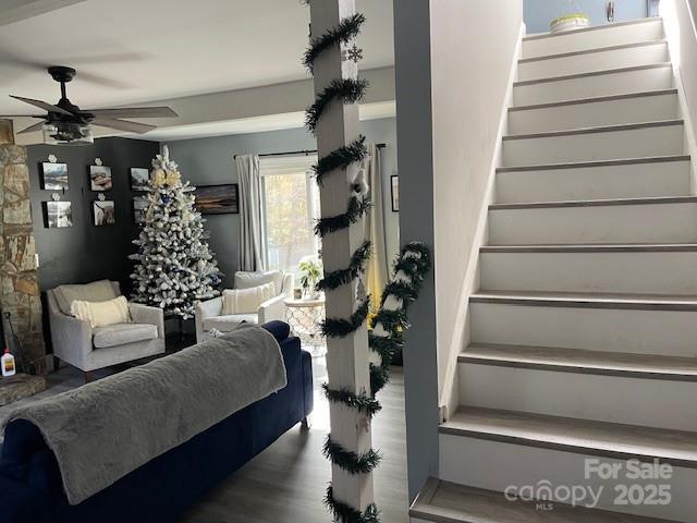 bedroom with ceiling fan and hardwood / wood-style floors