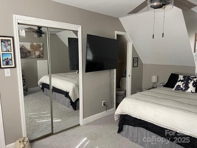 bedroom featuring ceiling fan, lofted ceiling, carpet, and a closet