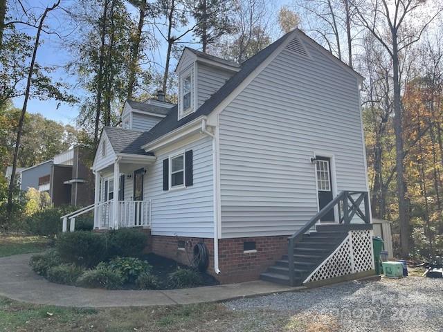 view of side of home with cooling unit