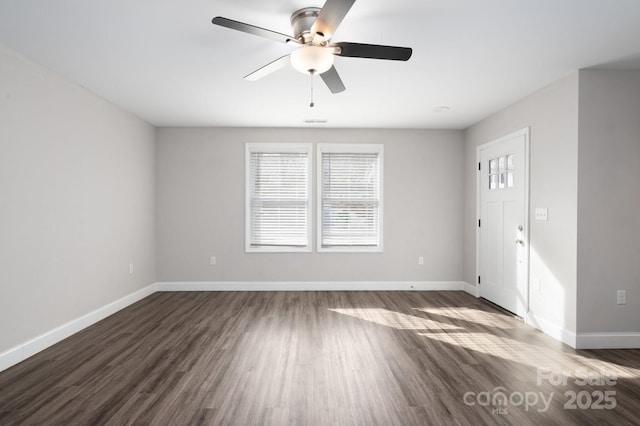 interior space featuring dark hardwood / wood-style flooring and ceiling fan