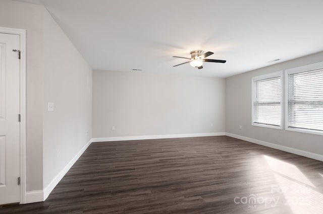 unfurnished room featuring dark hardwood / wood-style floors and ceiling fan