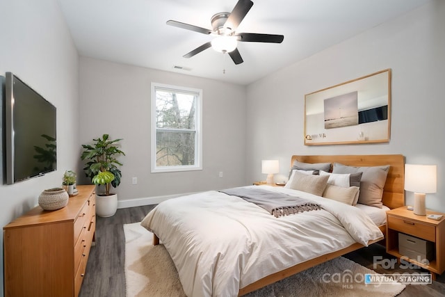 bedroom featuring dark hardwood / wood-style flooring and ceiling fan