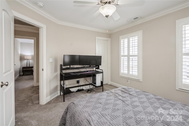 carpeted bedroom featuring ceiling fan and crown molding