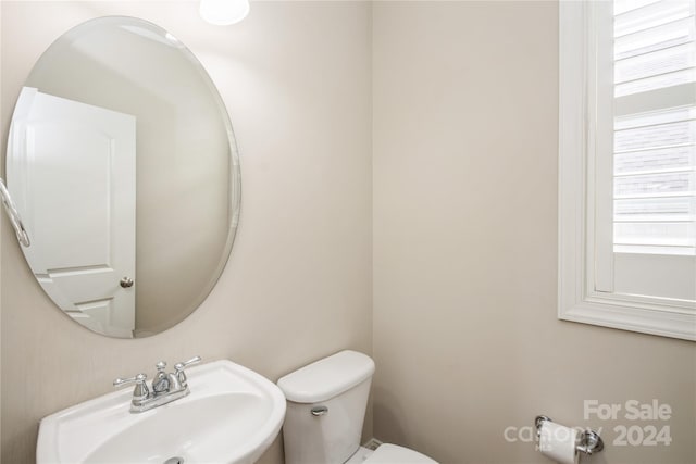 bathroom with toilet and sink