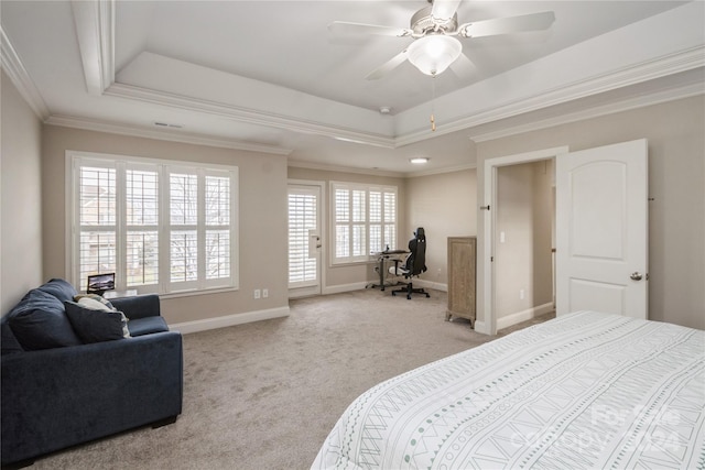 bedroom featuring ceiling fan, a raised ceiling, and ornamental molding