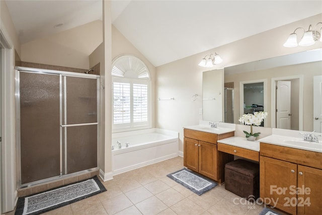 bathroom featuring tile patterned floors, vanity, shower with separate bathtub, and vaulted ceiling