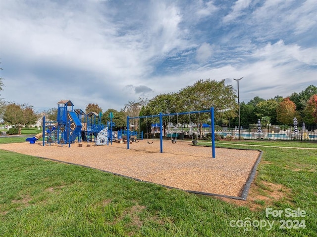 view of play area featuring a lawn