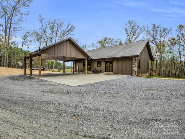 view of front of home featuring a carport