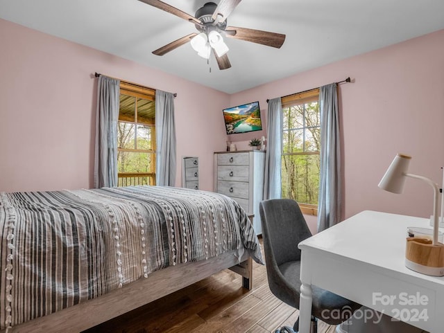 bedroom featuring ceiling fan and wood-type flooring