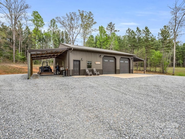 garage featuring a carport