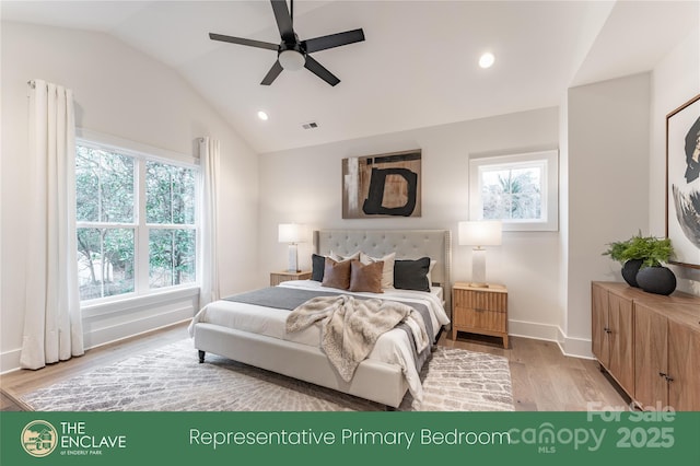 bedroom featuring ceiling fan, light wood-type flooring, and vaulted ceiling