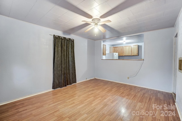 unfurnished room with light hardwood / wood-style floors and ceiling fan