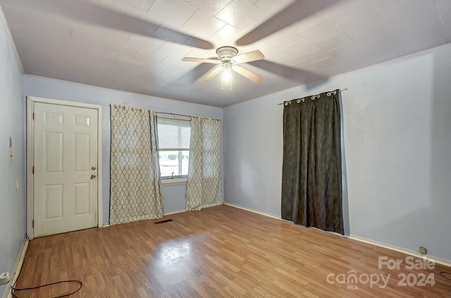 entrance foyer with ceiling fan and light hardwood / wood-style floors