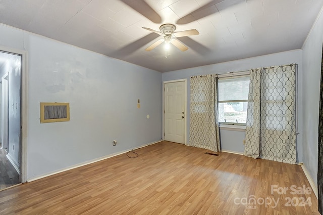 unfurnished bedroom featuring ceiling fan and light wood-type flooring