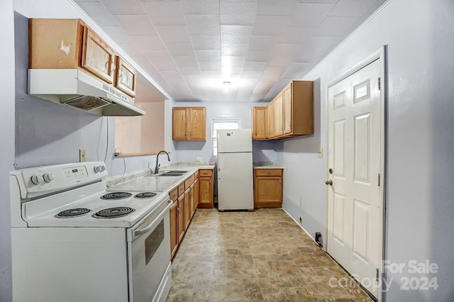 kitchen featuring sink and white appliances