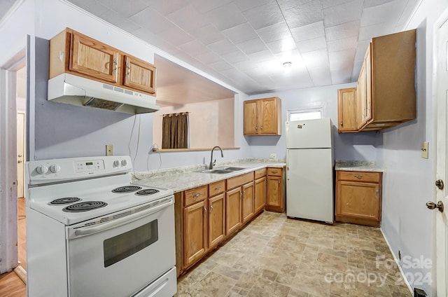 kitchen featuring white appliances and sink