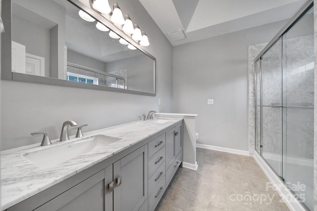 bathroom featuring vanity, toilet, and an enclosed shower