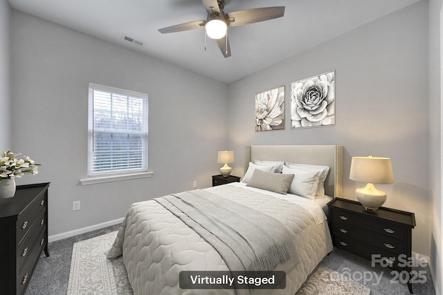 bedroom featuring light carpet and ceiling fan