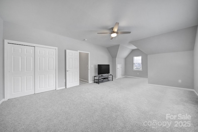 bonus room with ceiling fan, lofted ceiling, and light carpet