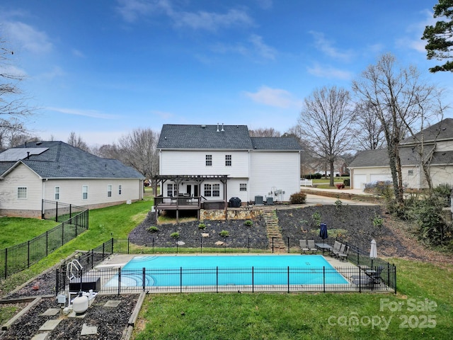 view of pool featuring a pergola, a wooden deck, a yard, and a patio