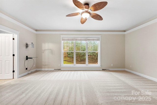 unfurnished room featuring ornamental molding, light carpet, and baseboards