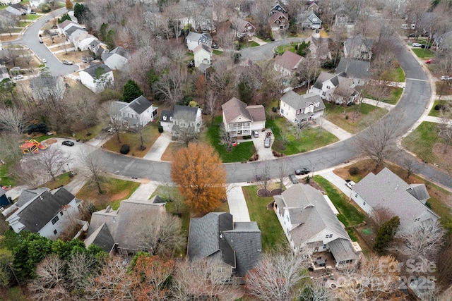 birds eye view of property with a residential view