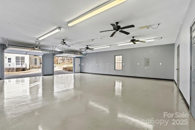 garage featuring electric panel and a garage door opener