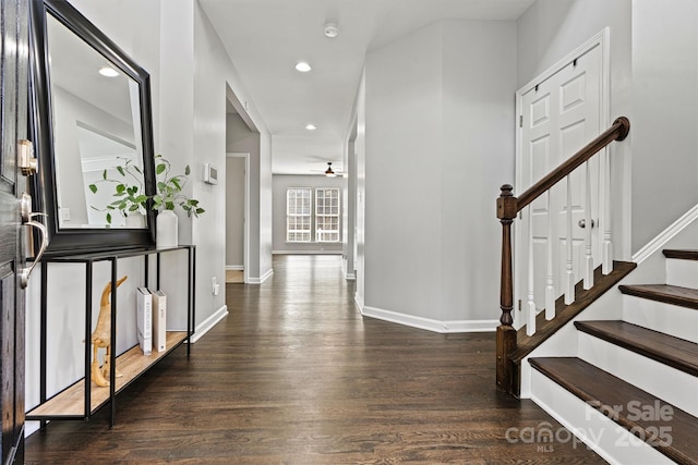 entrance foyer featuring ceiling fan and dark hardwood / wood-style floors