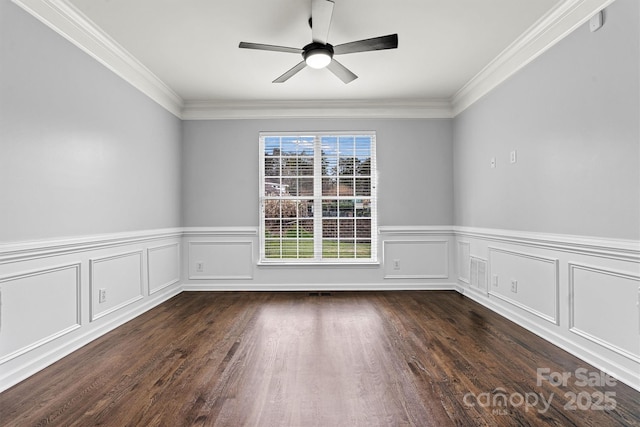 unfurnished room featuring ceiling fan, dark hardwood / wood-style floors, and crown molding