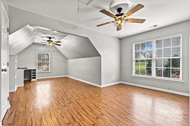 bonus room featuring ceiling fan, lofted ceiling, and light hardwood / wood-style floors