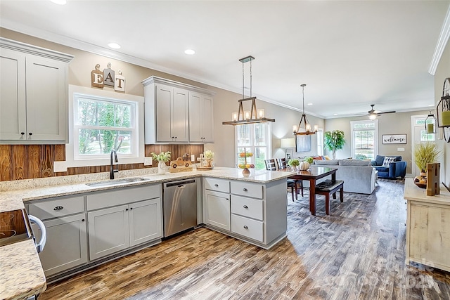 kitchen with dishwasher, ceiling fan with notable chandelier, gray cabinets, and sink