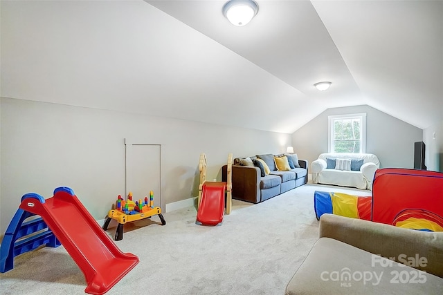 rec room featuring carpet floors and lofted ceiling