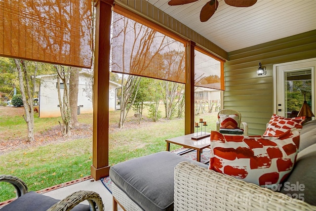 sunroom featuring ceiling fan