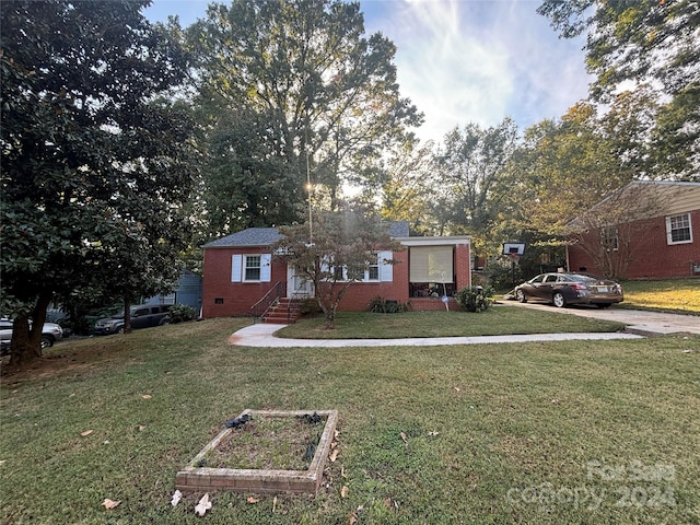 view of front of home with a front yard