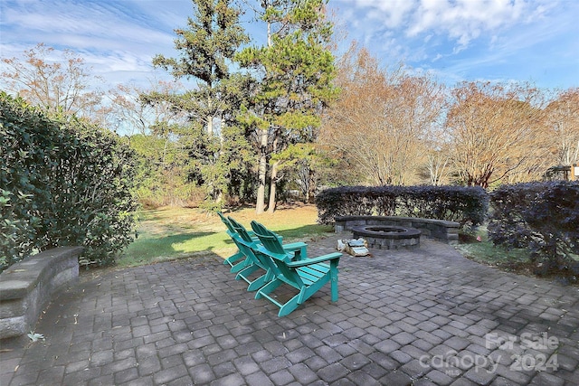 view of patio featuring a fire pit