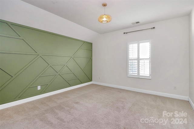 unfurnished room featuring carpet floors