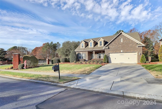 view of front facade featuring a front yard and a garage