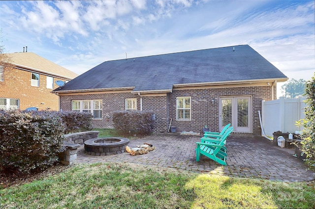 back of house featuring a patio area and an outdoor fire pit