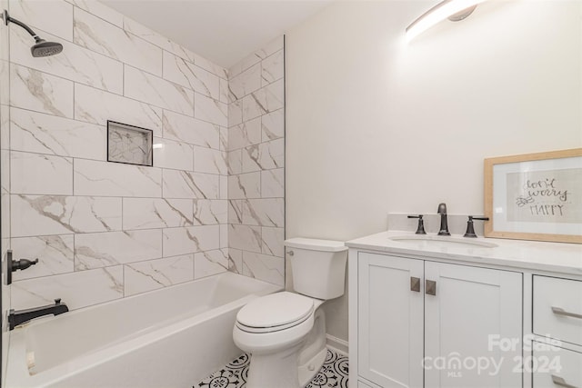 full bathroom with tile patterned floors, vanity, toilet, and tiled shower / bath combo