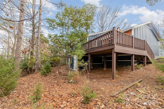 rear view of property featuring a deck