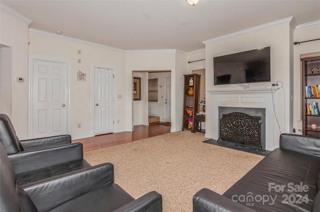 living room with dark wood-type flooring and ornamental molding