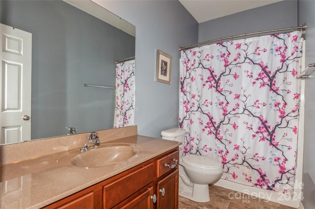 bathroom with vanity, toilet, and walk in shower