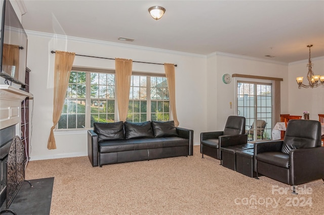 carpeted living room featuring a healthy amount of sunlight, crown molding, and a chandelier