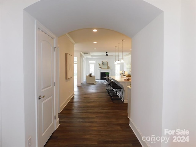 corridor with dark hardwood / wood-style floors