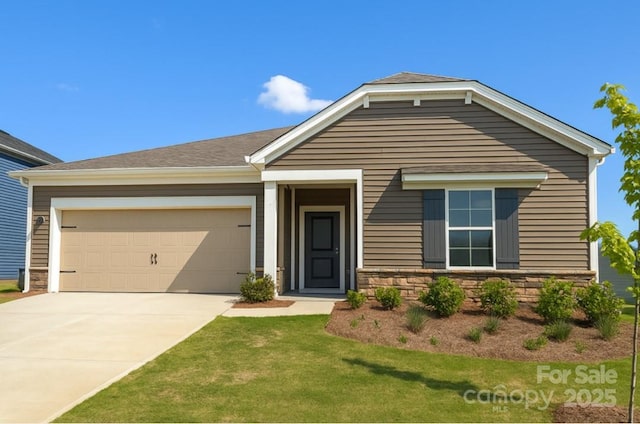 1531 Harper Landing Blvd, Stanley, NC 28164 - view of front of home featuring an attached garage, driveway, stone siding, and a front lawn