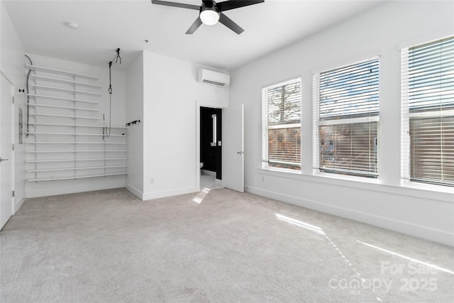 unfurnished bedroom featuring a wall mounted air conditioner, light colored carpet, and ceiling fan