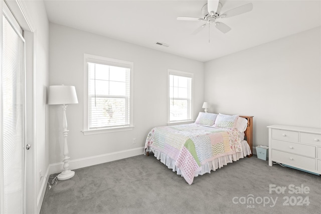 carpeted bedroom featuring ceiling fan